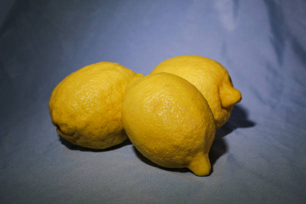 ripe yellow lemon on a blackboard, ripe lemon on a black background