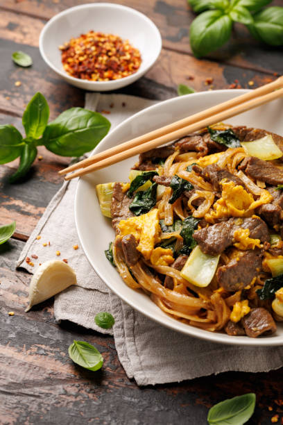 istock Thai Pad See Ew with beef, eggs, vegetables and rice noodles. 2159972379