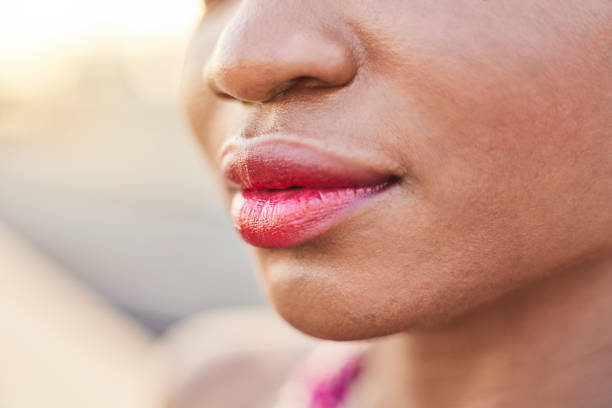 istock Close-up of a black African woman's lips 2159972760
