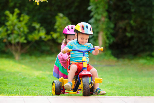 istock Two children riding bikes 2159982603