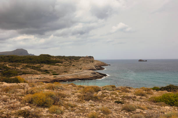 View of the sea of ​​Mallorca in front of Cala Mitjana, on a cloudy day.