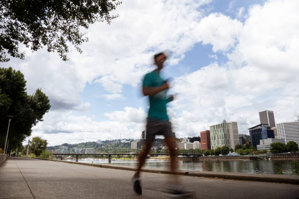 istock Motion Blur of People Jogging Running on the Waterfront 2159987012