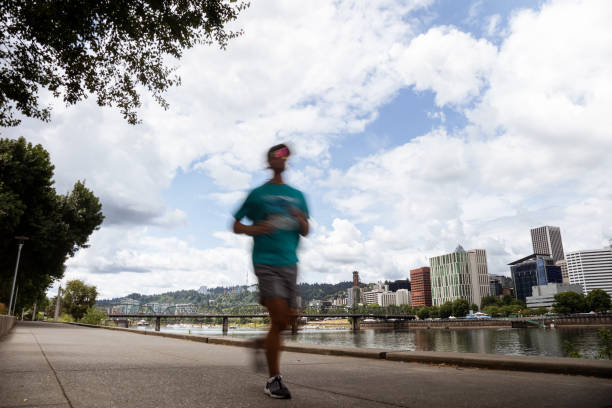 istock Motion Blur of People Jogging Running on the Waterfront 2159987016
