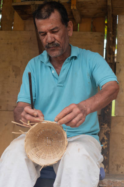 istock Artisan Focused on Weaving Basket 2159988709