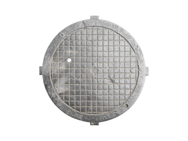 A abstract design emerges after a rainstorm and a city manhole cover.