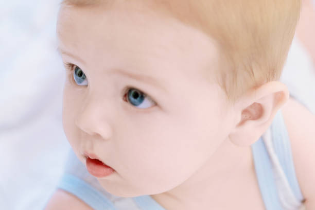 istock Adorable baby boy looking away from camera 2159992206