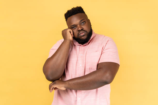 istock Man leans on hand, looking depressed, having indifferent gloomy expression has no energy. 2159993667