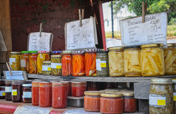 Amish Jars of Preserves Glass jars of jams, relishes, pickles and sauces offered for sale at a roadside stand in Lancaster County, Pennsylvania on a June afternoon. Amish stock pictures, royalty-free photos & images