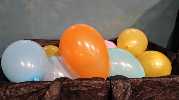 Melbourne, Victoria, Australia, April 14th 2019: A street performer is making and selling balloon animals at Southbank next to the Yarra River on a sunny day