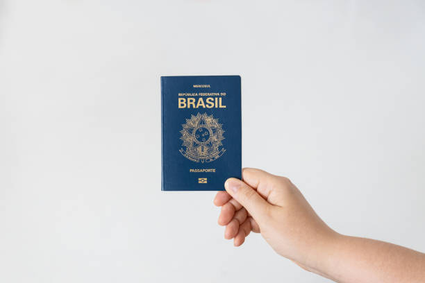 istock Hand holding a Brazilian passport 2159997479