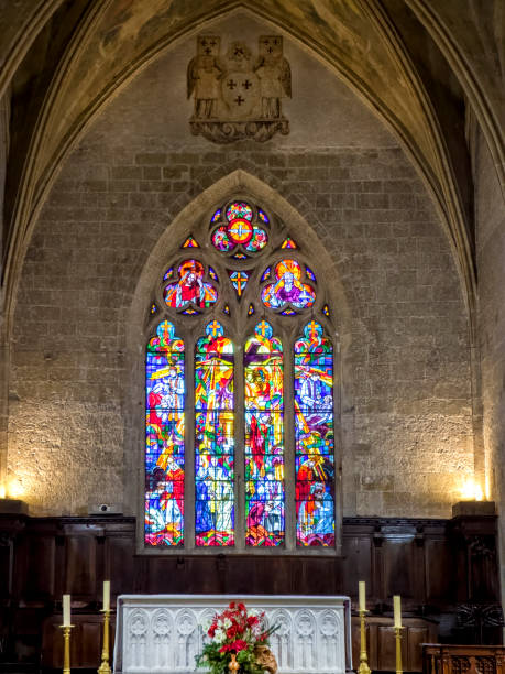 istock Ancient stone church interior with stained glass window 2159998030