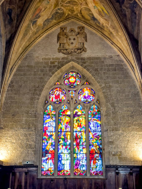 istock Ancient stone church interior with stained glass window 2159998088