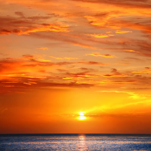 istock Beautiful orange color seascape during sunset 2159998475