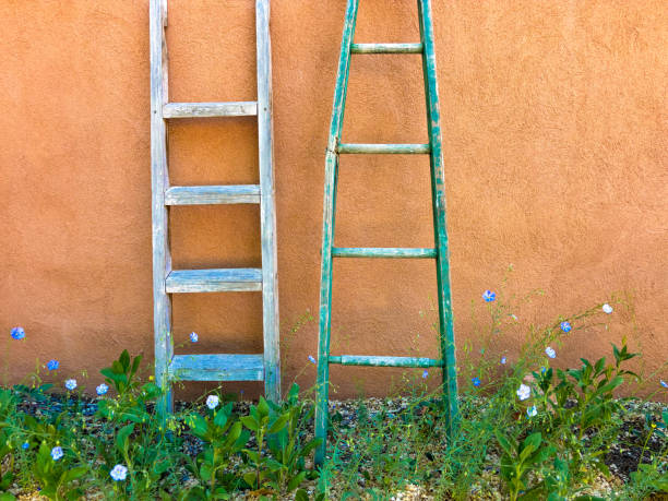 Santa Fe, NM: Two Antique Wood Ladders Against Adobe Wall