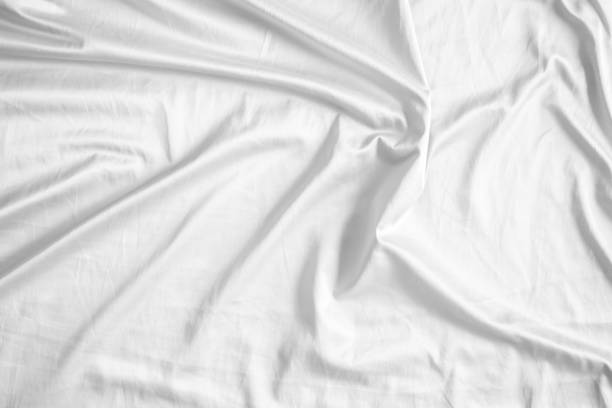istock Abstract white wrinkled bedding sheet fabric texture background 2160002196