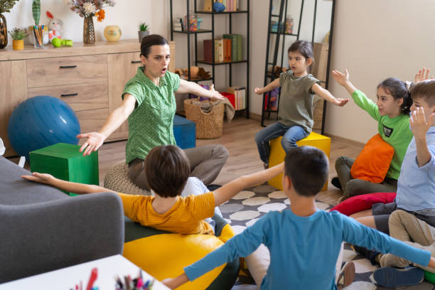 istock Energetic kids and teacher in sign language class 2160002742