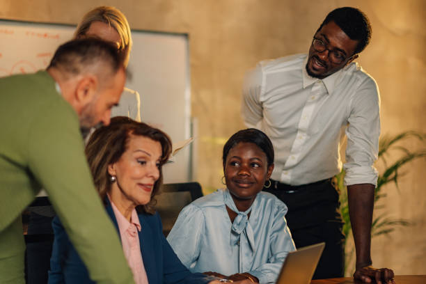 istock Interracial team typing on a laptop and working on a project at office 2160002849