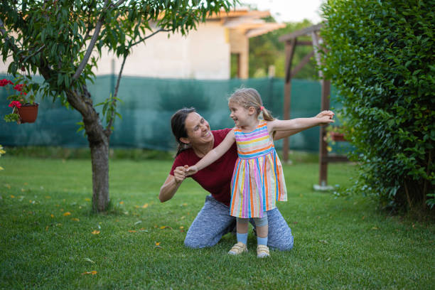 istock Backyard Workout for Kids. Mom & Daughter Doing Exercises. 2160003024