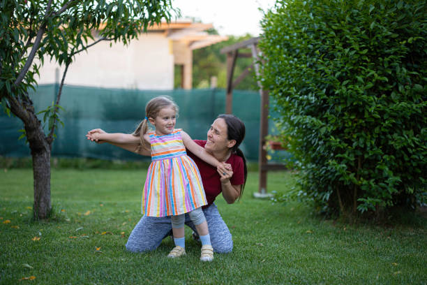 istock Backyard Workout for Kids. Mom & Daughter Doing Exercises. 2160003026