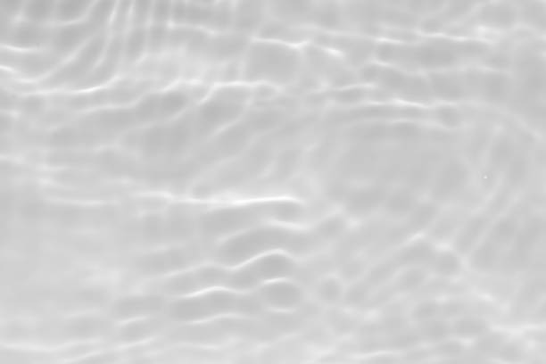 istock Blue water with ripples on the surface. Defocus blurred transparent blue colored clear calm water surface texture with splashes and bubbles. Water waves with shining pattern texture background. 2160006887