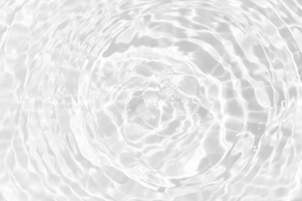 istock Blue water with ripples on the surface. Defocus blurred transparent blue colored clear calm water surface texture with splashes and bubbles. Water waves with shining pattern texture background. 2160006888