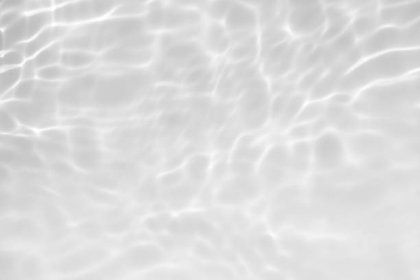 istock Blue water with ripples on the surface. Defocus blurred transparent blue colored clear calm water surface texture with splashes and bubbles. Water waves with shining pattern texture background. 2160006895