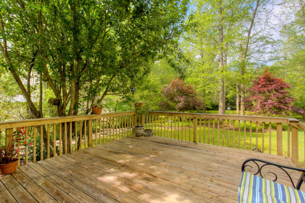 istock Summer Wooden Deck In The Backyard With Surrounding Trees And Greenery 2160007535