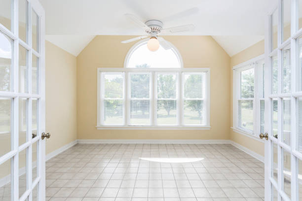 istock Empty Sunroom With Tile Floor, Arch Window, And French Doors Closure 2160008145