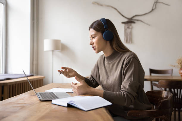 istock Positive manager woman talking to client on video call 2160011607