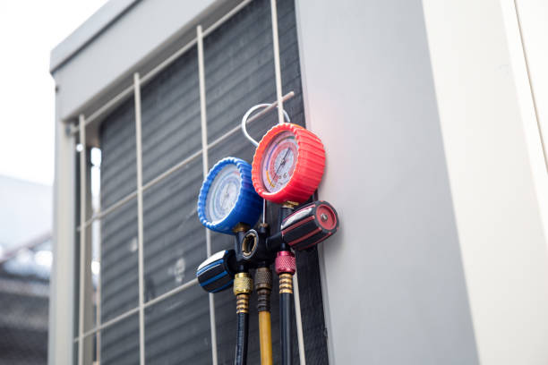 Air conditioning service,HVAC Using a gauge to check the refrigerant in the system. Concept of inspection and maintenance services