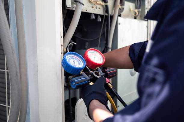 istock Air conditioning, HVAC service technician using gauges to check refrigerant and add refrigerant,Air Conditioning Repair, repairman on the floor fixing air conditioning system. 2160012039