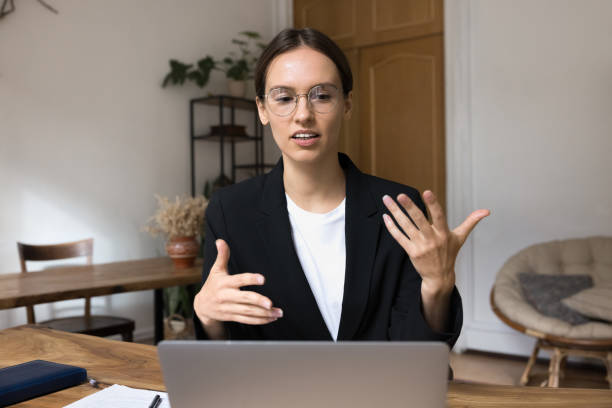 istock Serious project manager woman engaged in business online communication process 2160012316