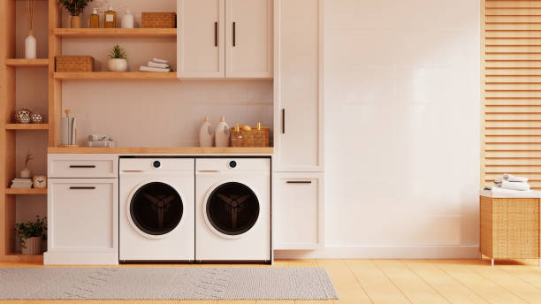 istock Modern washing machine in a laundry room against a white wall background- 3D rendering 2160017474