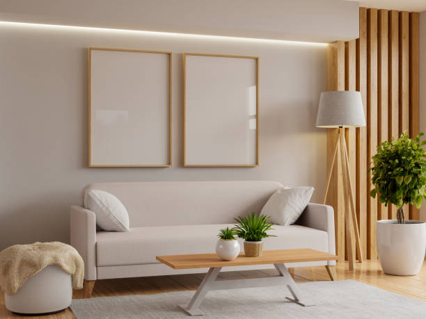 istock Living room with a sofa and picture frames bathed in warm sunlight- 3D rendering 2160017496
