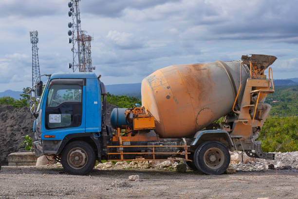 A cement mixer truck in a parking lot