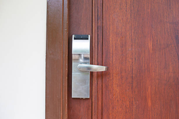 istock Key card door knob lock, brown door, space copy space 2160019683