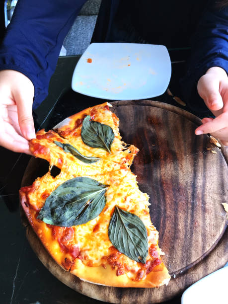 istock Pizza with mozzarella cheese, tomatoes and basil leaves. 2160019715