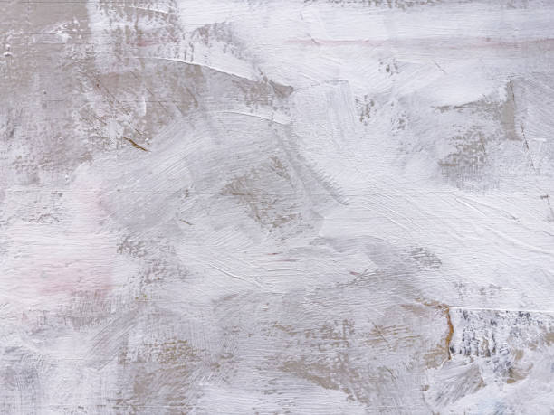 istock weathered gray background hand painted with white acrylic paint. 2160020362