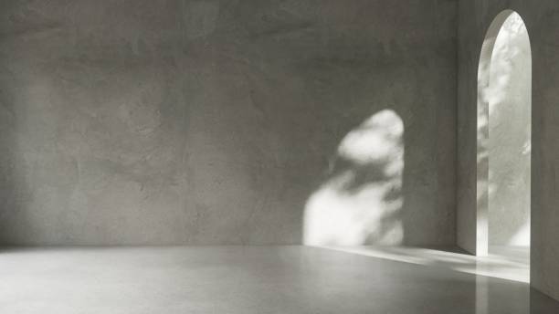istock Empty blank polished cement wall room in sunlight from arch door 2160020575