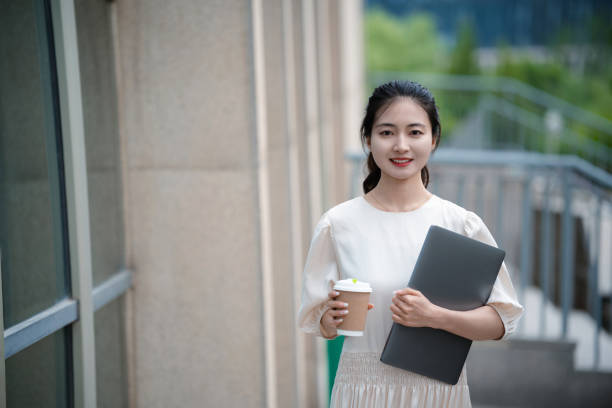 istock Adult female university student on university campus 2160022201