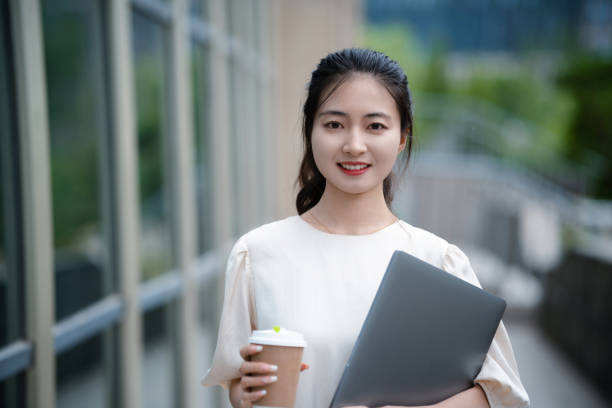 istock Adult female university student on university campus 2160022205