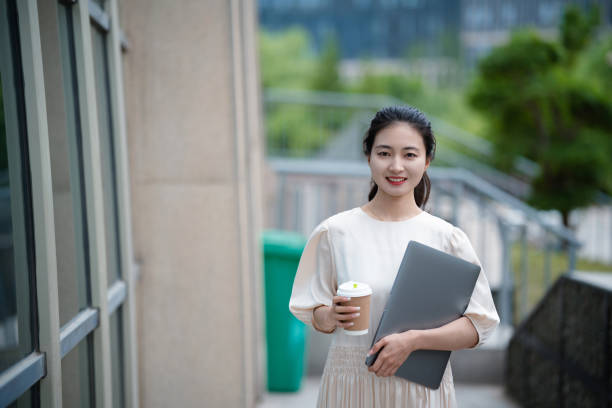 istock Adult female university student on university campus 2160022206