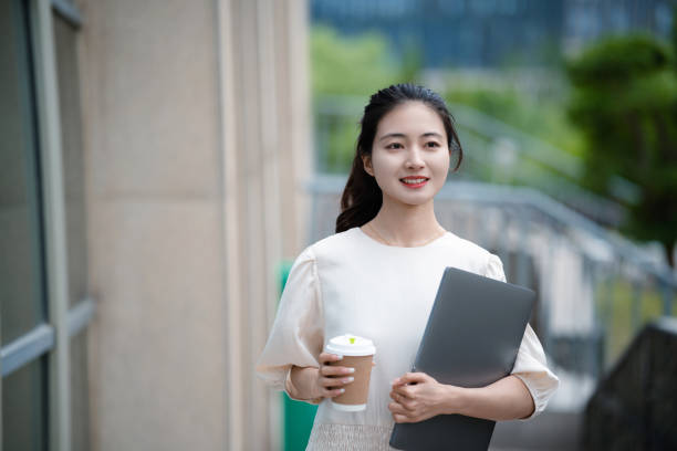 istock Adult female university student on university campus 2160022224