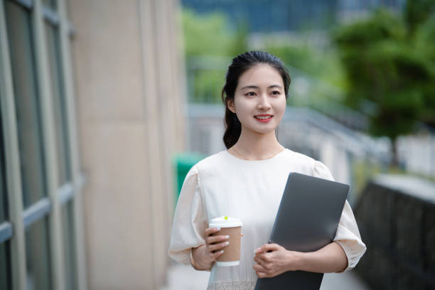 istock Adult female university student on university campus 2160022225
