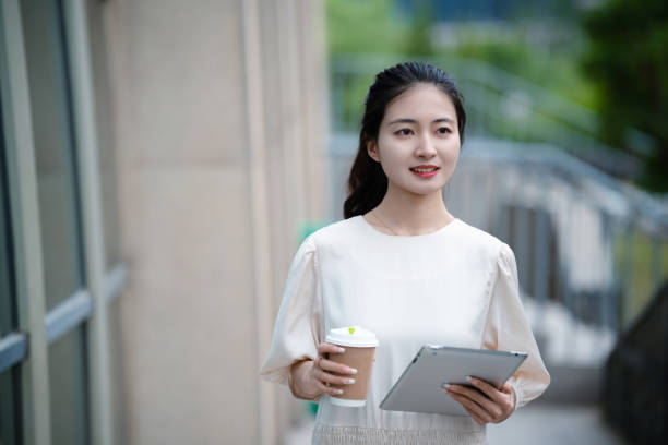 istock Adult female university student on university campus 2160022239