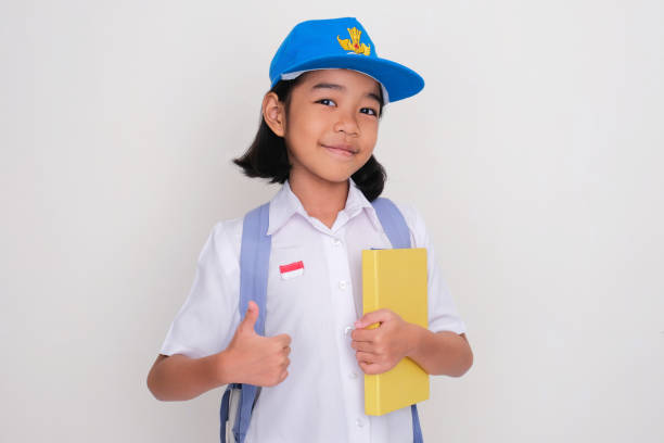 istock Indonesia kid school student smiling and give thumb up 2160023317