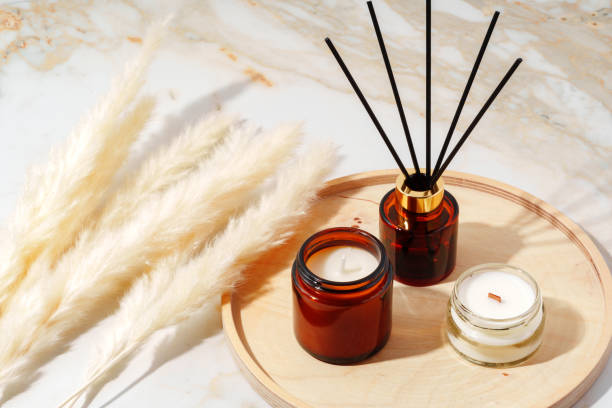 istock Scented Candles and Reed Diffuser on a Wooden Tray 2160026028