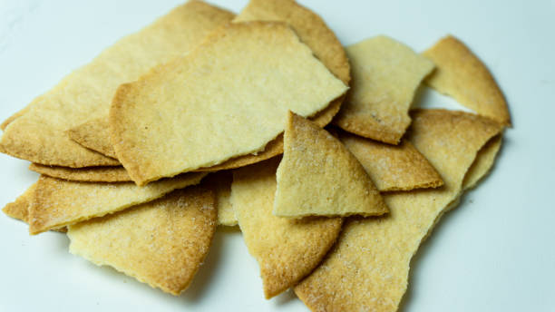 istock Broken baked chips crisps isolated on white background 2160026512