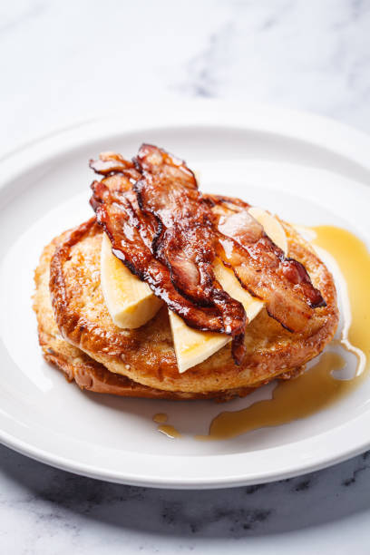 French toast with bacon, banana and maple syrup.