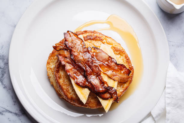istock French toast with bacon, banana and maple syrup. 2160027552